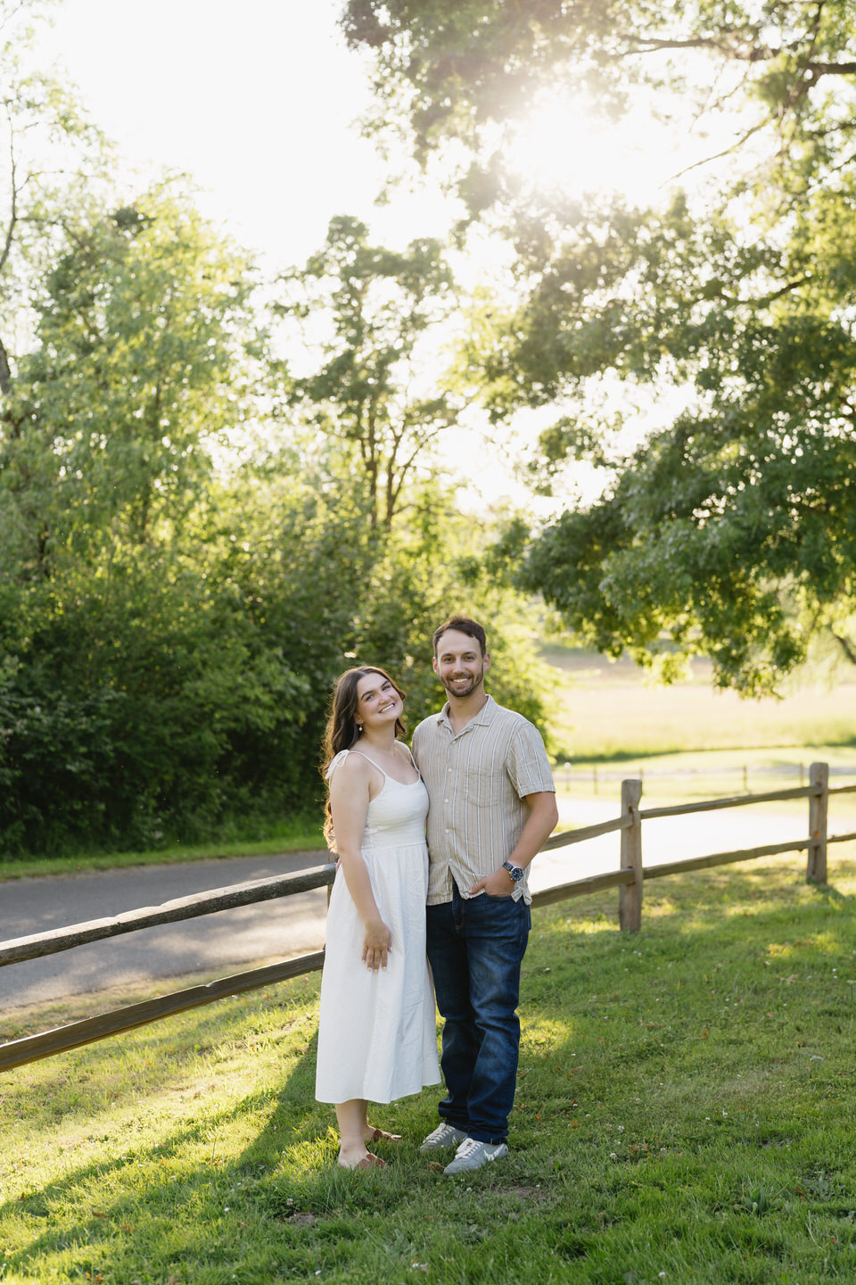 Summer engagement photos in front of a cute fence on Sauvie Island.