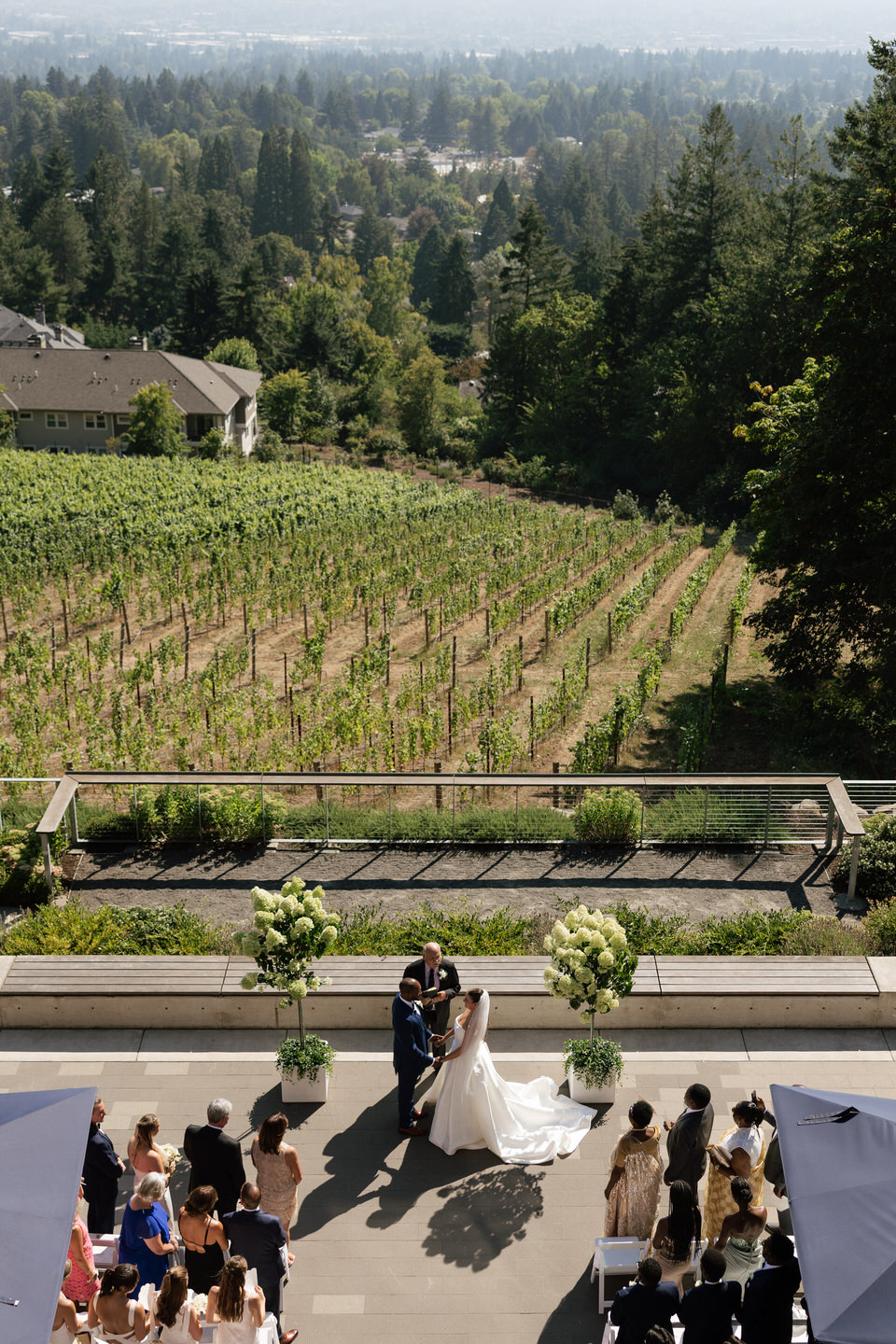 Outdoor wedding ceremony overlooking the vineyard at Amaterra in Portland, Oregon.