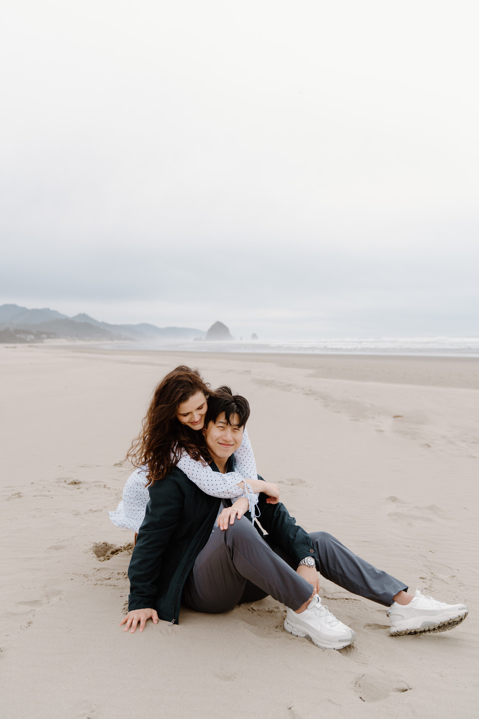 Natural engagement photo in Oregon with romantic and coastal scenery.