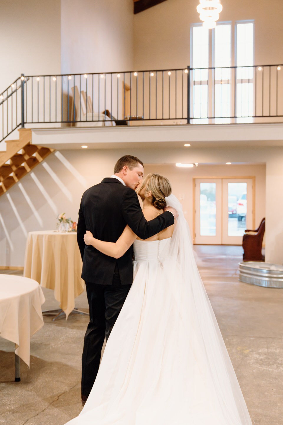 Bride and groom kiss after their wedding ceremony at The Barn at Countryside.