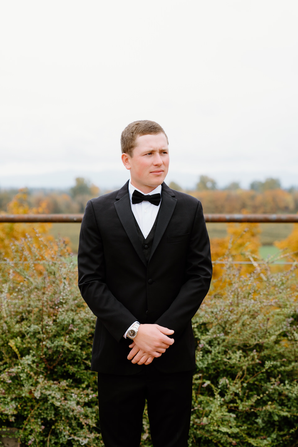Groom solo portrait wearing a bow tie.