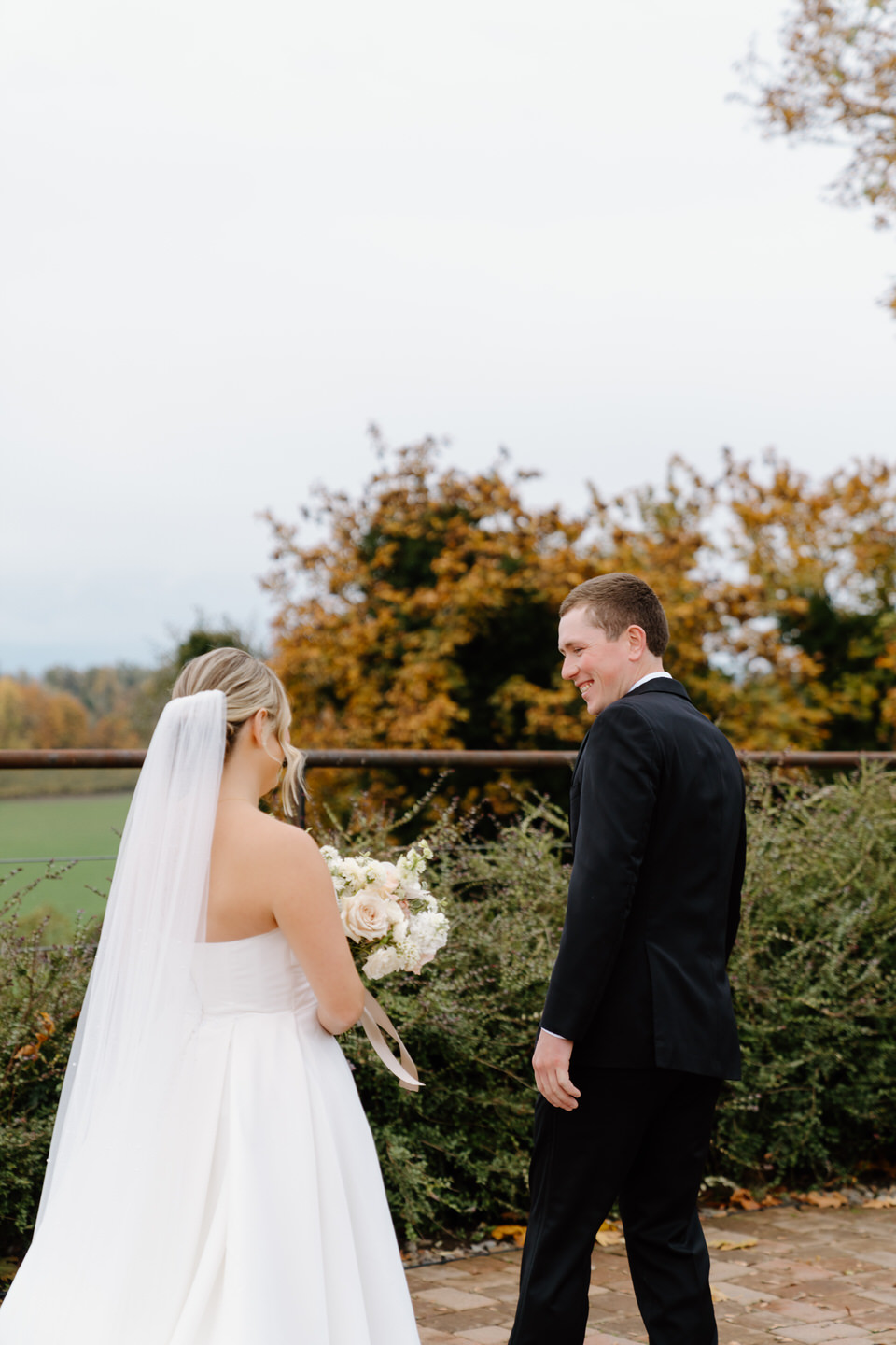 Groom turns around to see his bride for the first time on their wedding day.