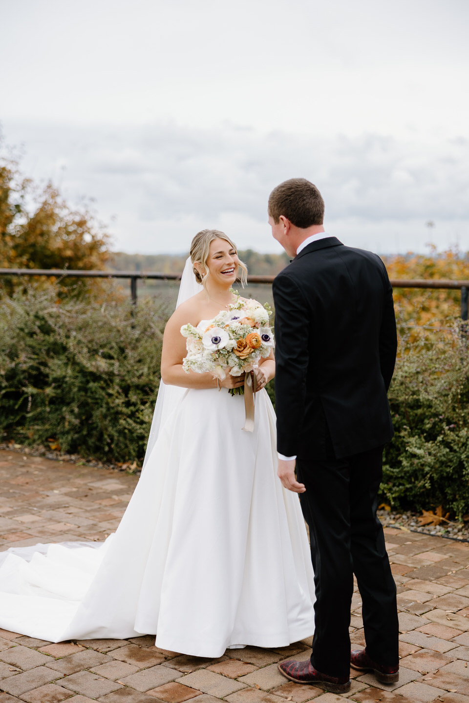 Fall wedding couple shares the excitement of their first look before the wedding ceremony.
