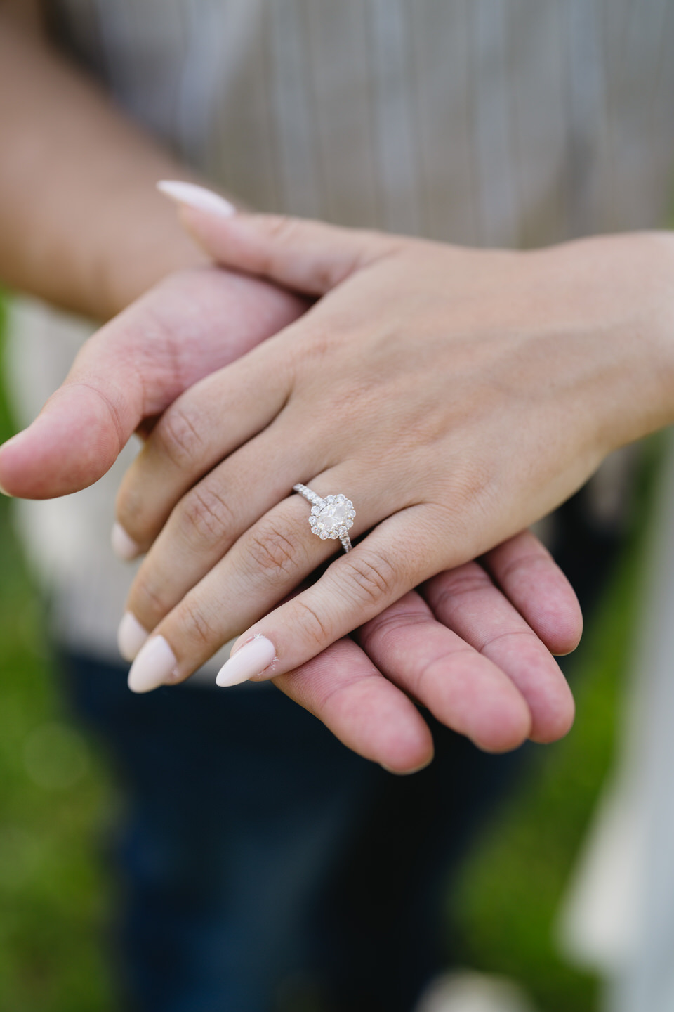 Oval engagement ring with halo.