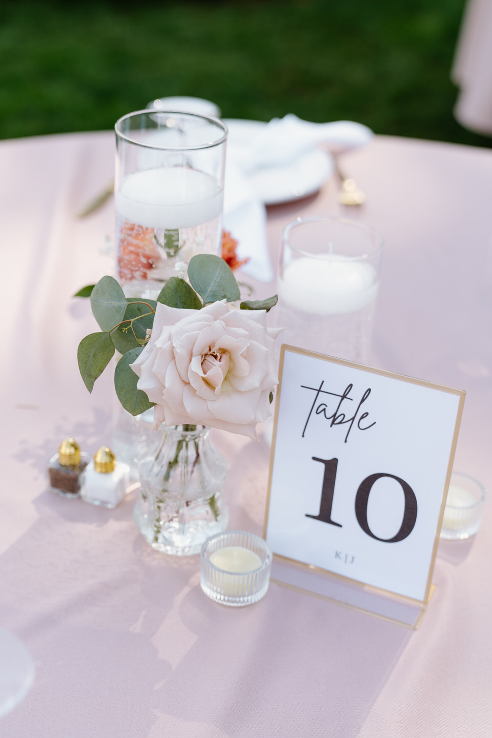 Light pink wedding reception table decor.