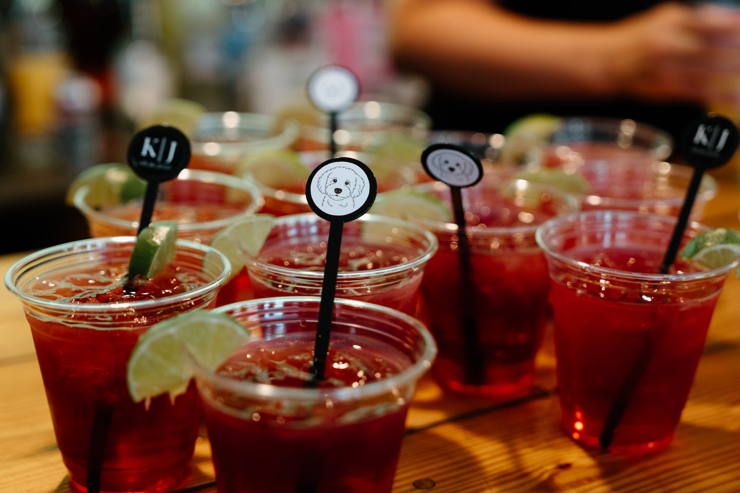 Personalized drink stirrers for wedding cocktails, featuring the couple's dog.