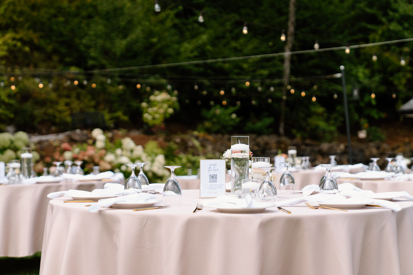 Champagne-colored table linens with reception decor.