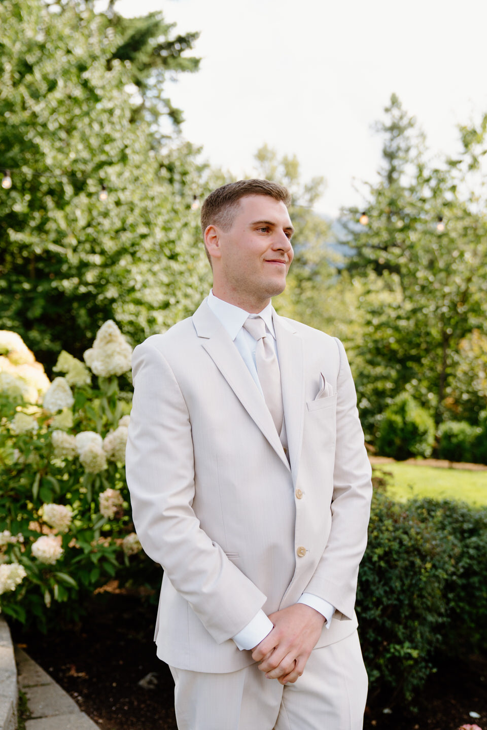 Groom sees his bride walking down the aisle for the first time.