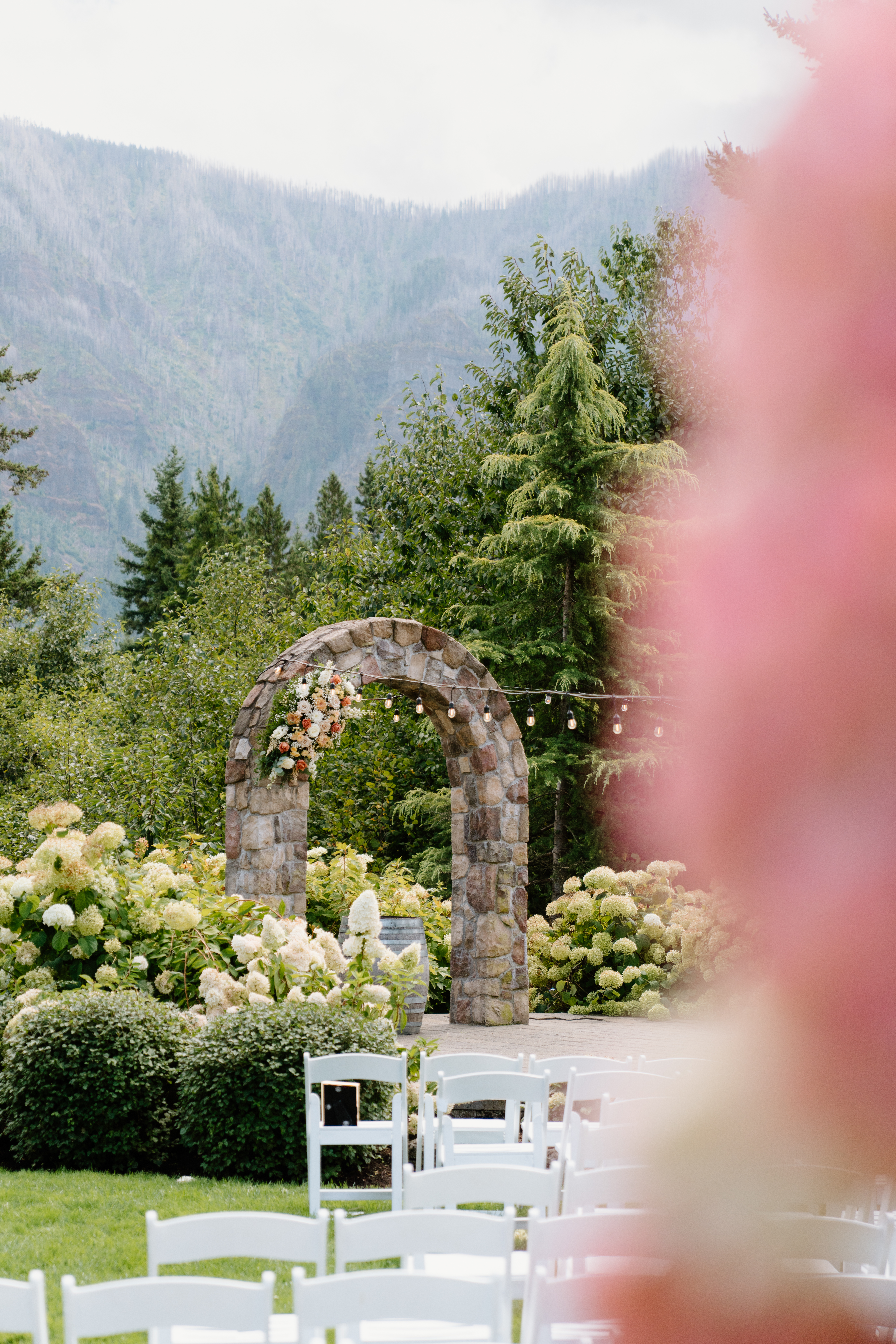 Stone ceremony arch at Cape Horn Estate wedding venue.
