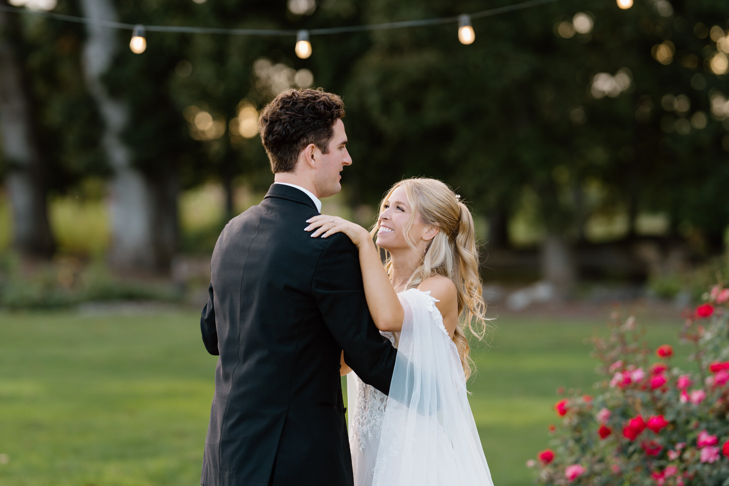 Couple shares their first dance in an outdoor wedding reception at Postlewaits.