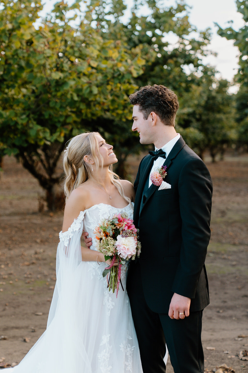 Wedding portraits in the orchard at Postlewait's in Oregon.