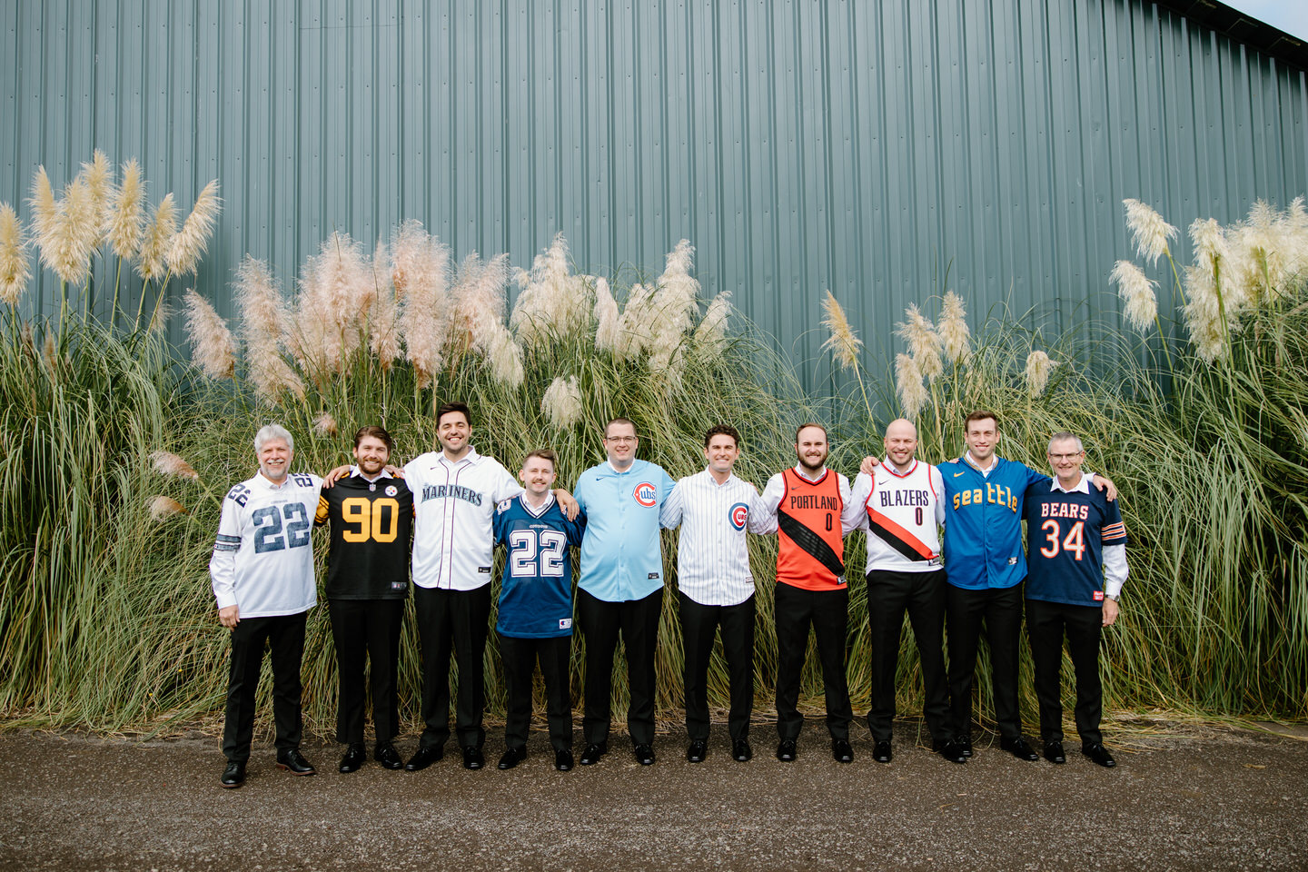 Groom and his groomsmen representing their favorite sports teams.