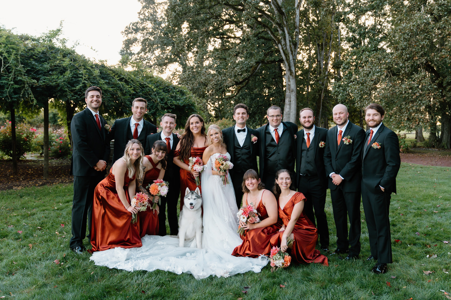 Wedding party group photo, including the couples' dog, after their ceremony at Postlewaits.