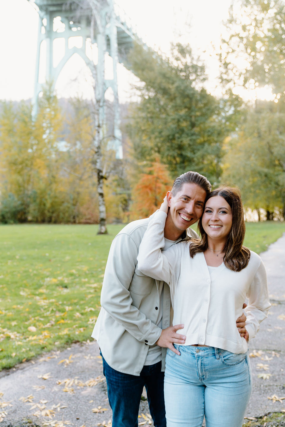 Woman reaches back for her fiancé's face.