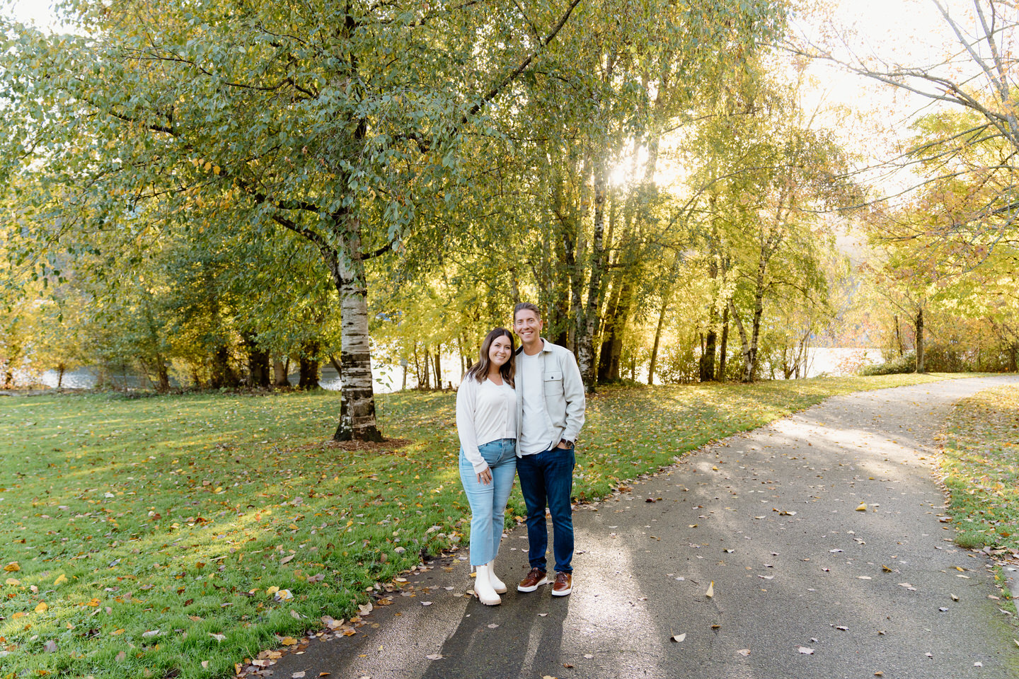 Sun shines through the fall foliage during Portland engagement photo shoot.