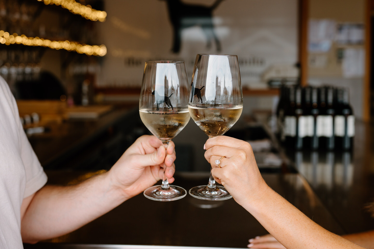 The Winery at Manzanita wine glasses in front of the bar.