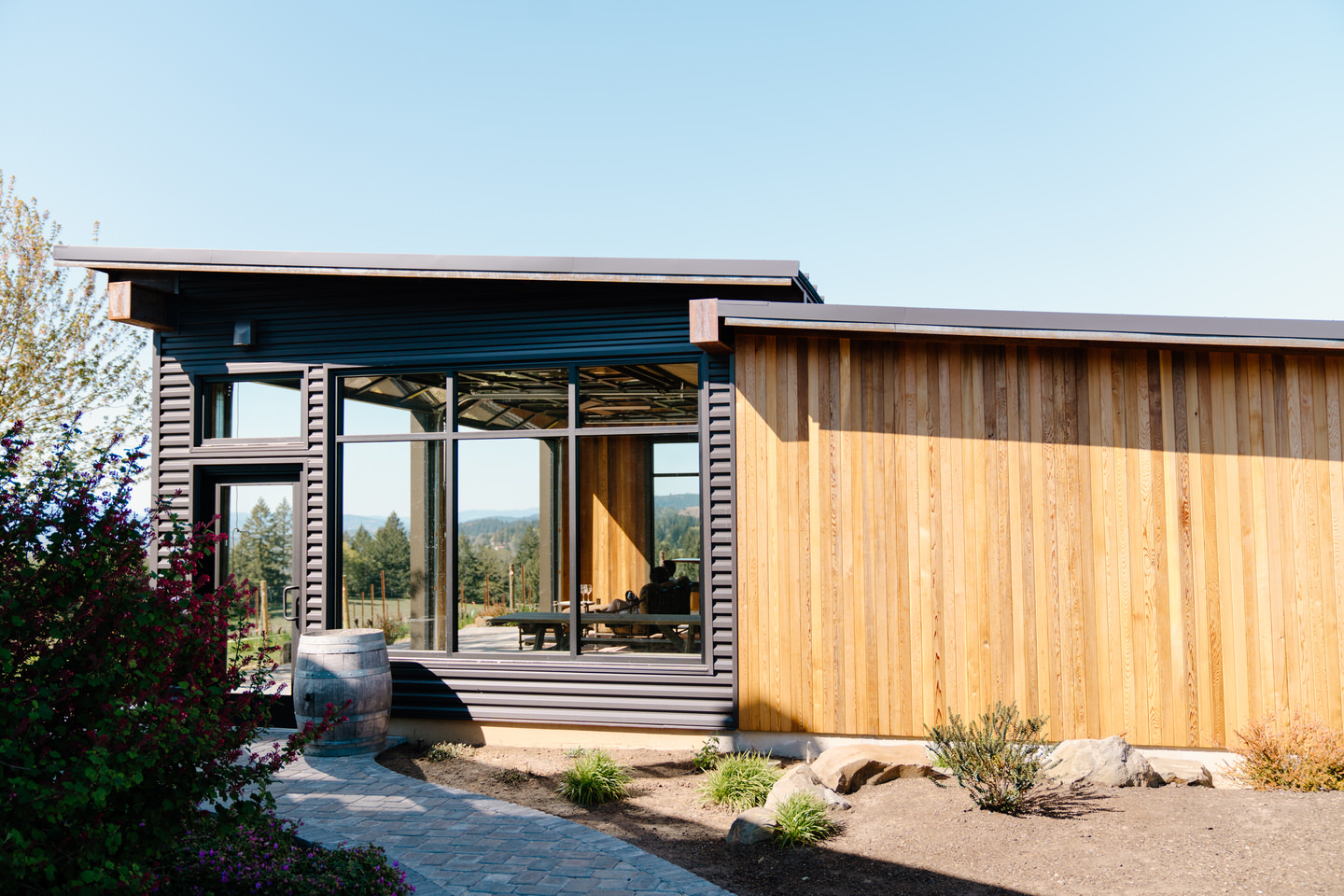 Architectural detail of Eminent Domaine winery surrounded by vineyards during an April engagement session.