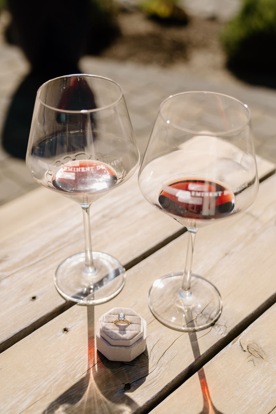 Oregon wine country proposal featuring a pear shaped engagement ring photographed at Eminent Domaine winery.