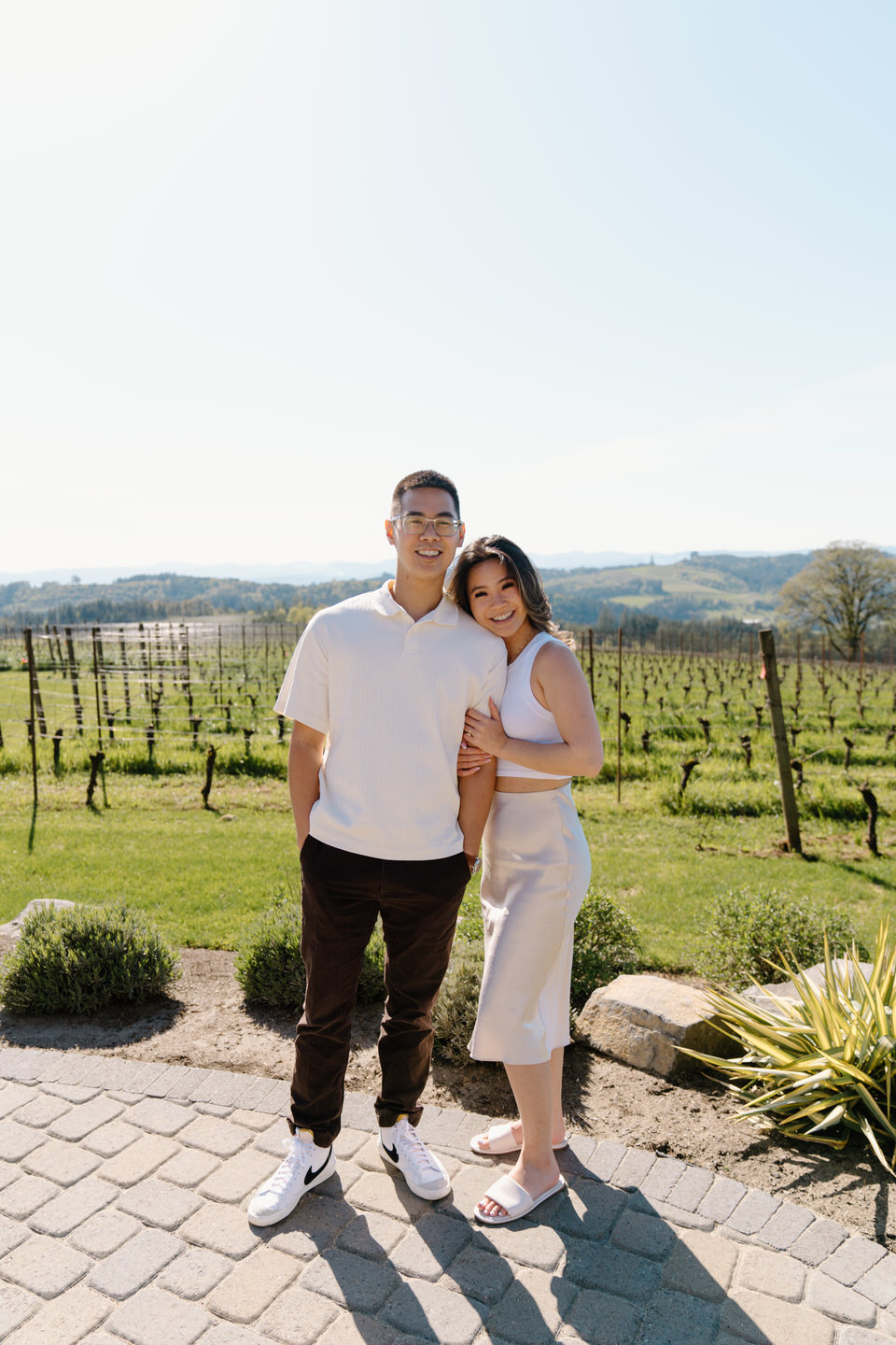 Oregon wine country proposal with scenic vineyard views at Eminent Domaine winery during a warm April afternoon.