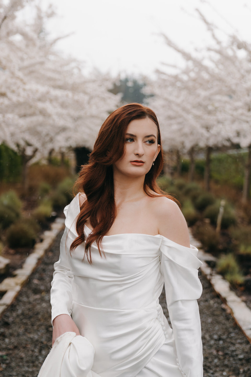 Bridal portrait at Chateau de Lis in the spring, surrounded by cherry blossoms.