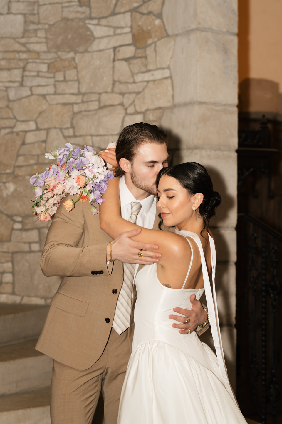 Flash photo of bride and groom on the grand staircase of Chateau de Lis.