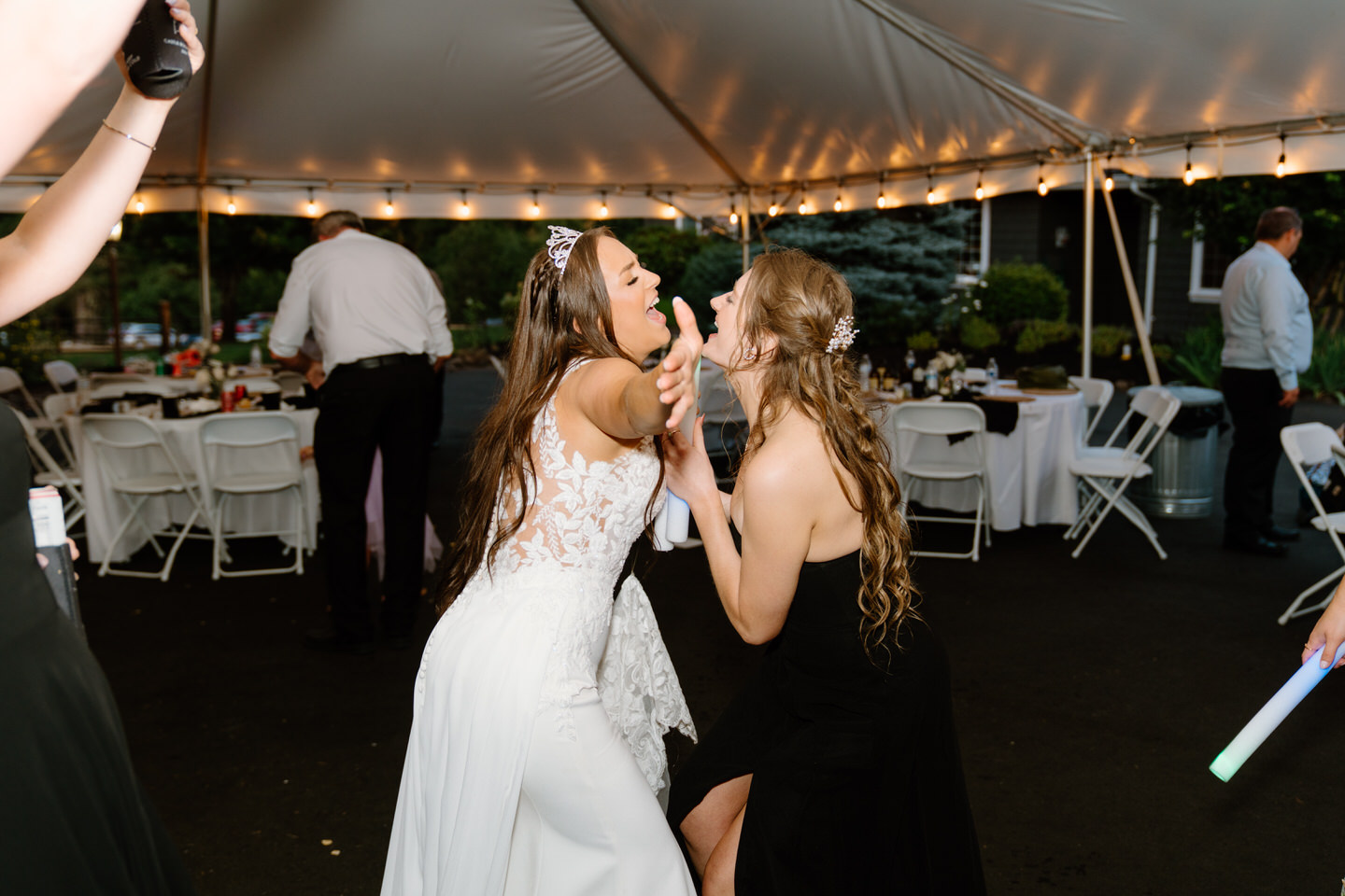 Hailey dancing and laughing with a guest on the dance floor.
