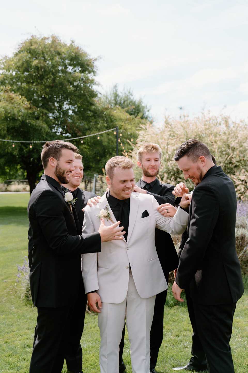 Tyler laughing with his groomsmen.
