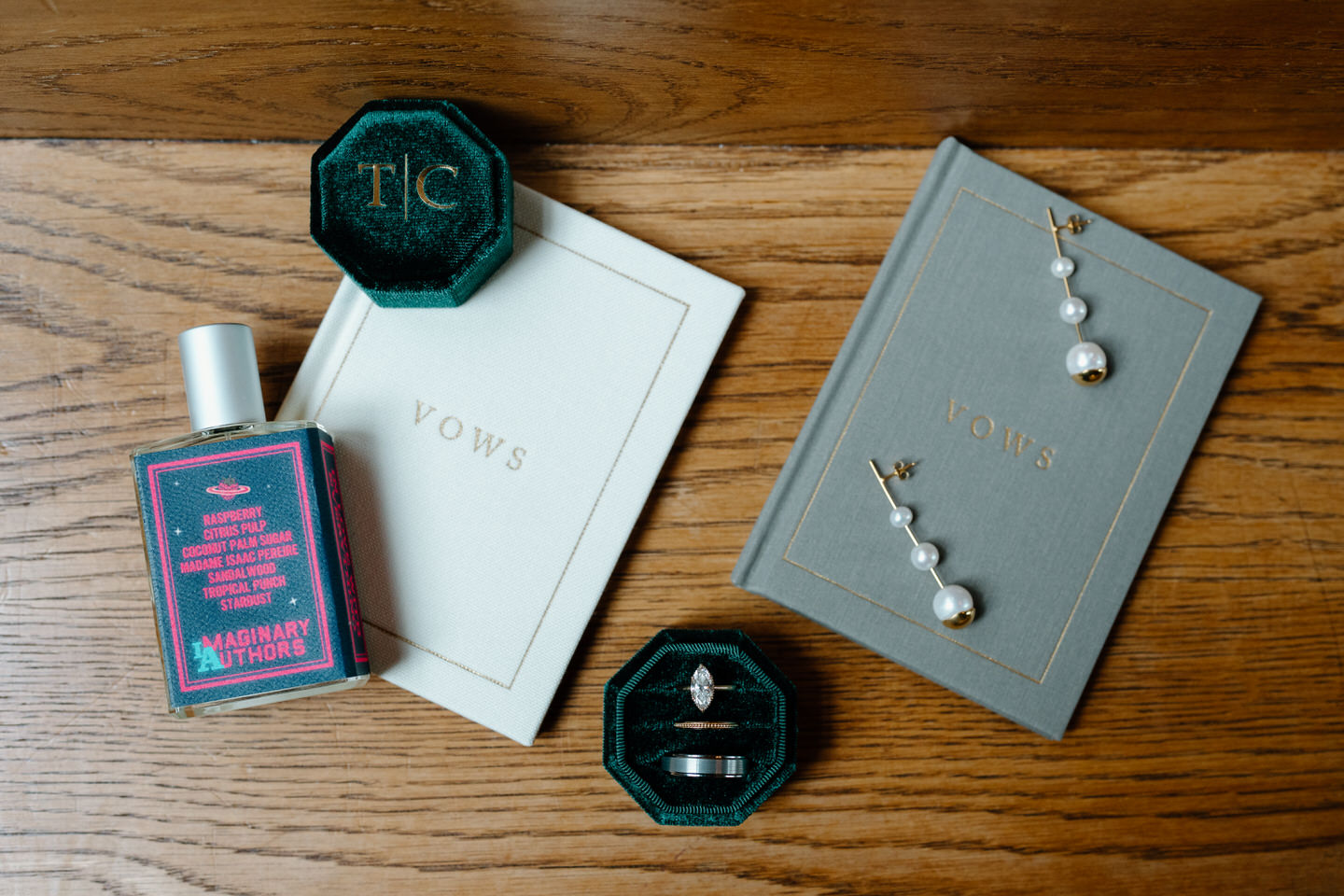 Wedding invitation suite with rings and stationery styled on wood church pews during a Portland Oregon wedding.
