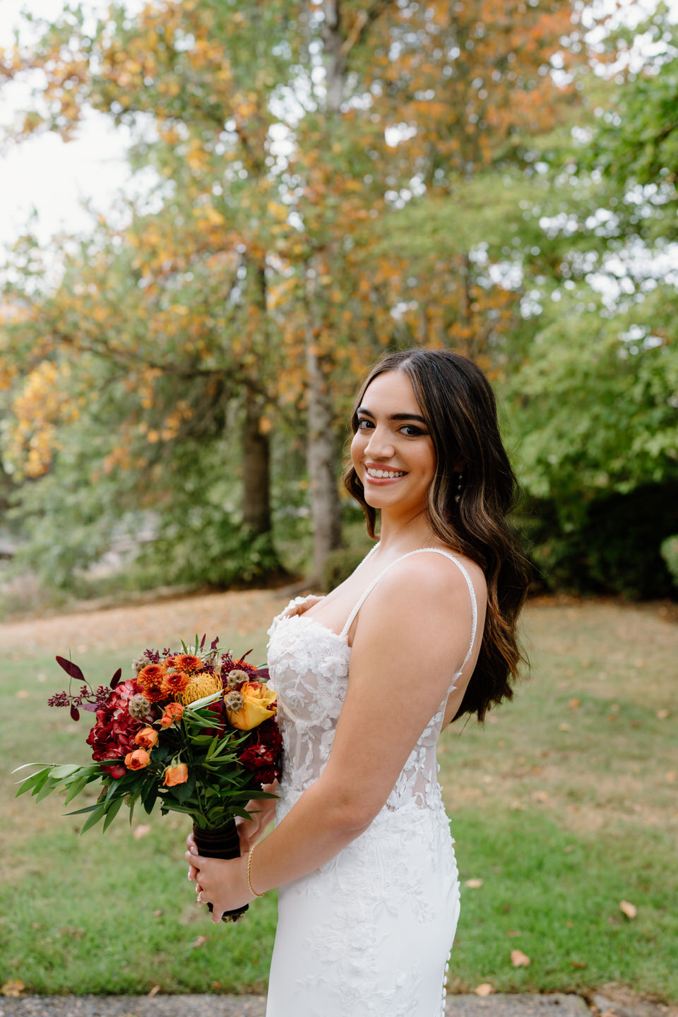 Fall bridal portrait of Teagan in the fall foliage outside Oaks Pioneer Church.