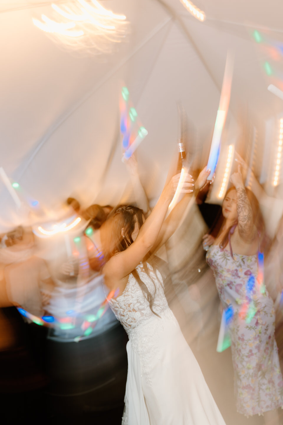 Blurry dance floor photo under the white tent at Castle Rock Lavender Farm.