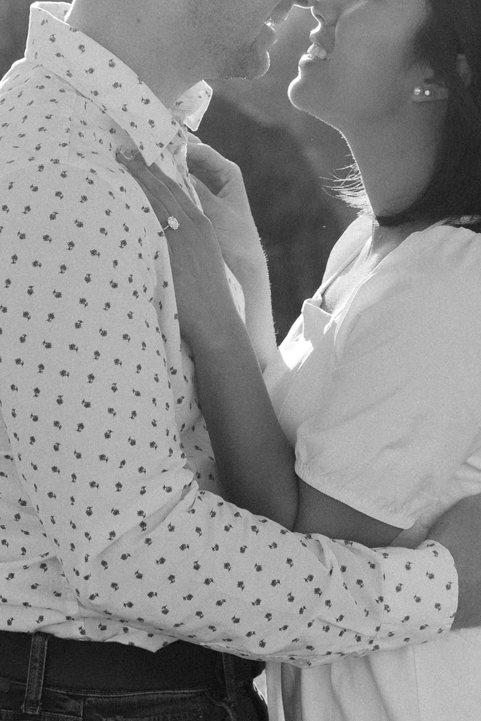 Close up of couple's hands and mouths during Rowena Crest engagement photos.