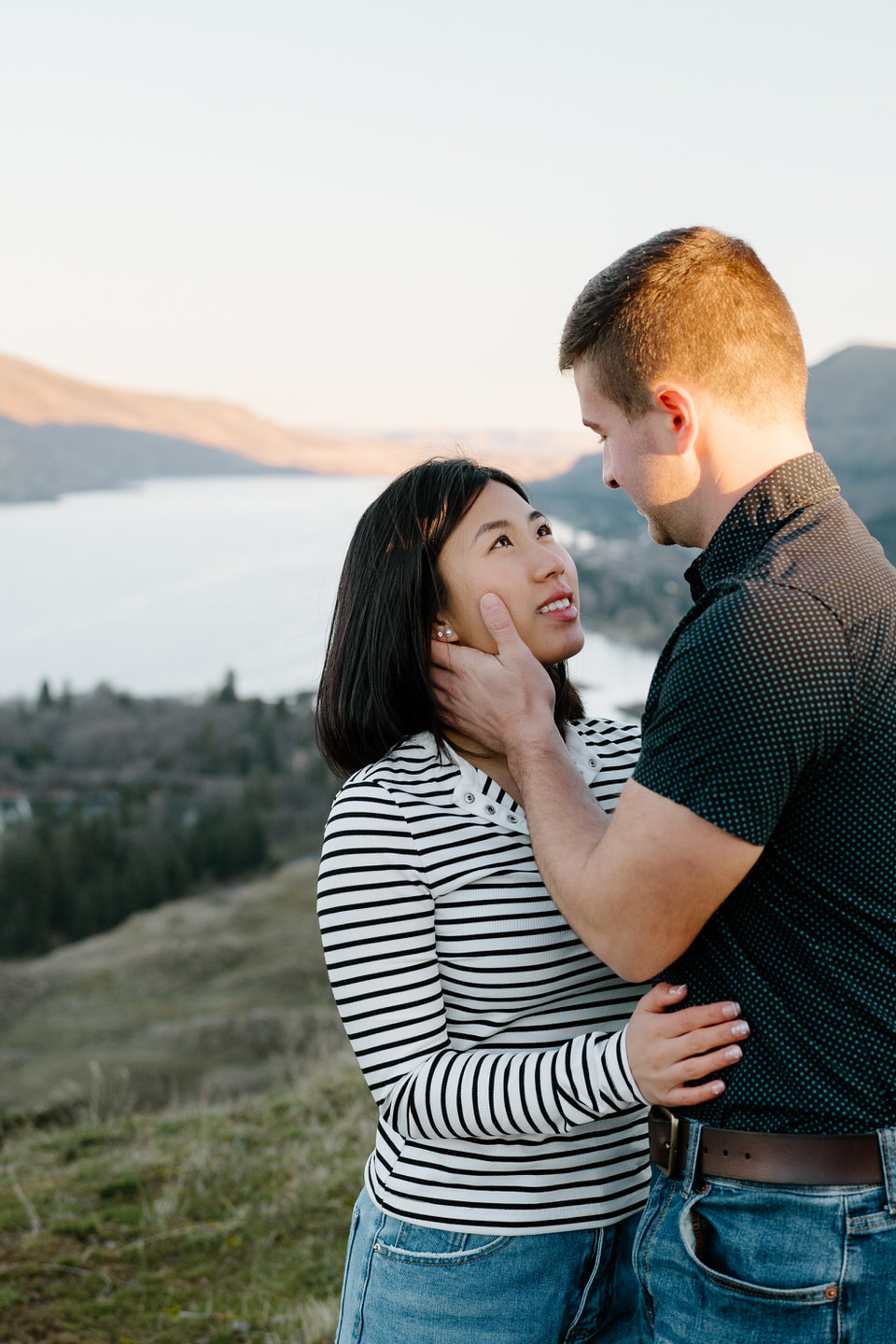 Alex pulls in Min during their engagement photos at Rowena Crest.