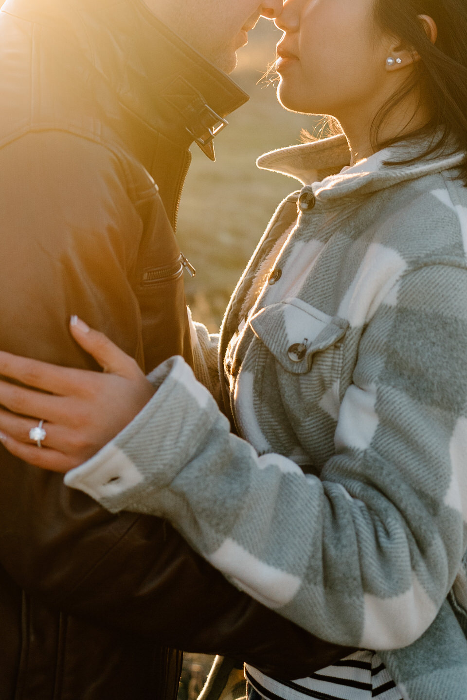 Close up of couple with their noses together in winter clothes for winter Rowena Crest engagement photos.