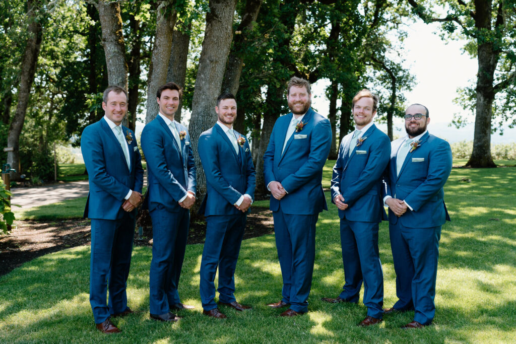 groomsmen in navy suits