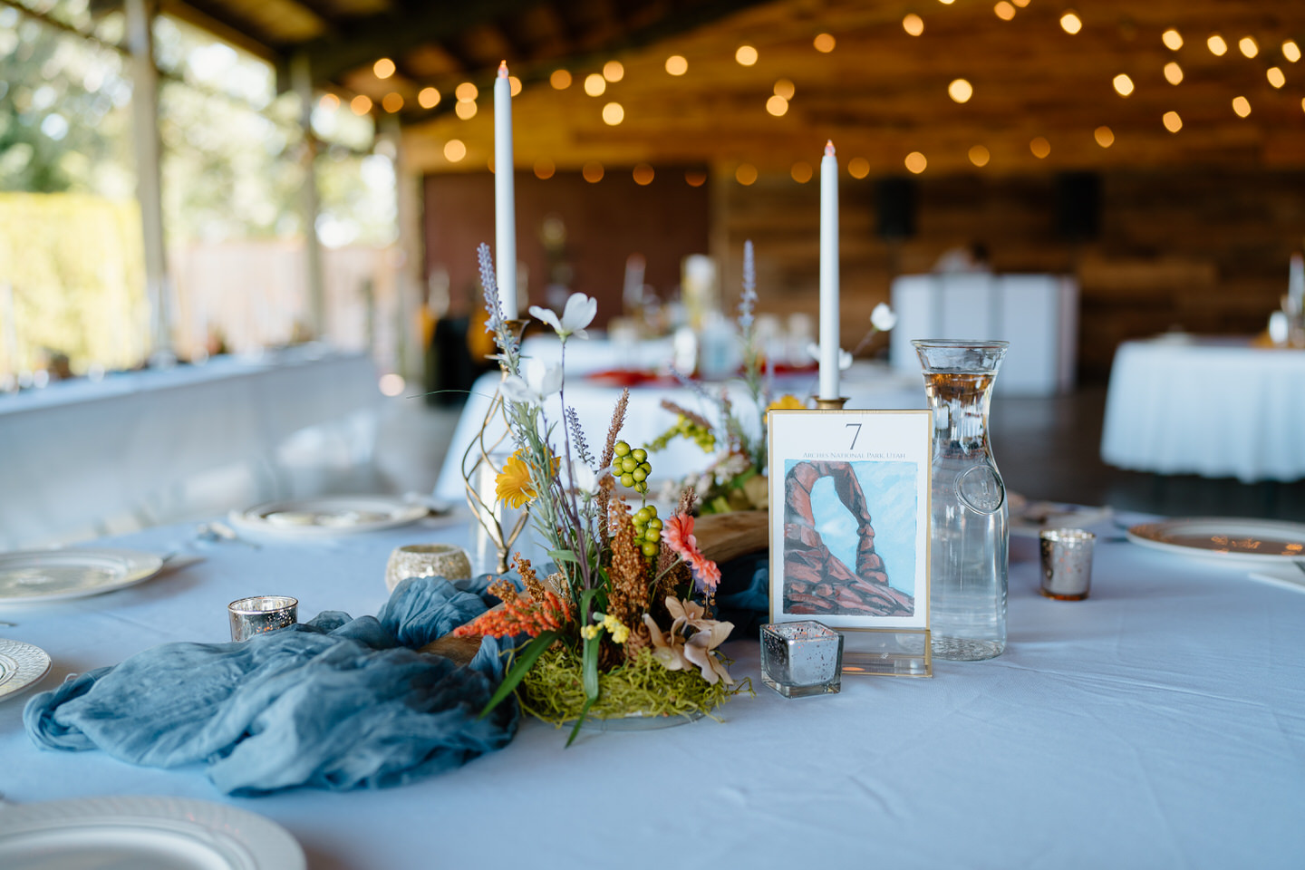 The reception space at Scholls Valley Lodge is a covered pavilion area, allowing for open air to enjoy a warm summer day.