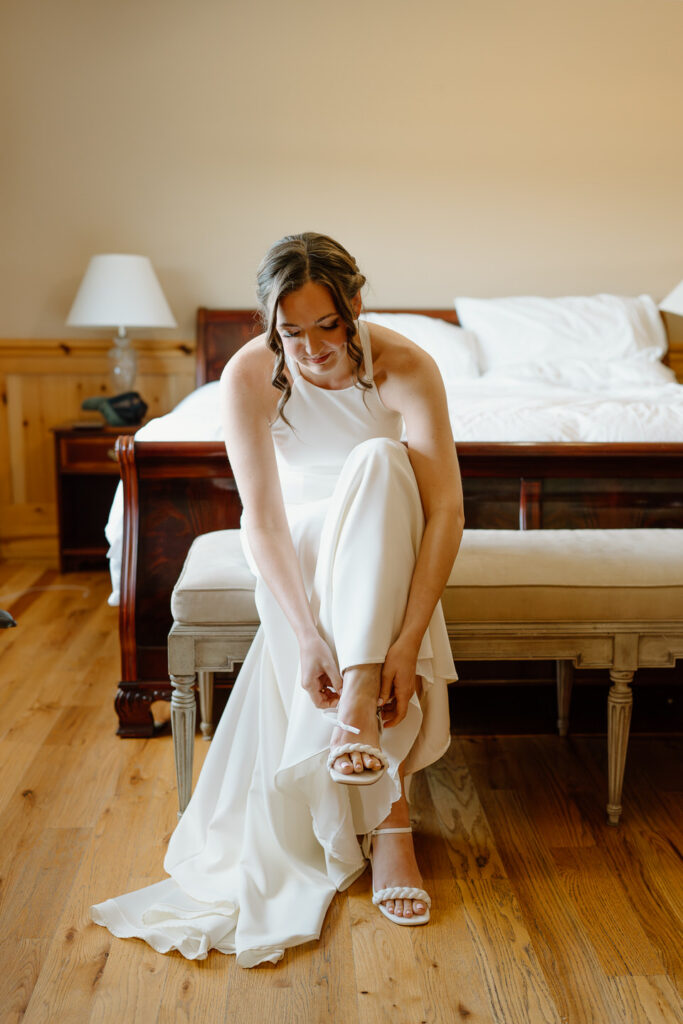 Bride putting on her shoes in the bridal suite at Scholls Valley Lodge