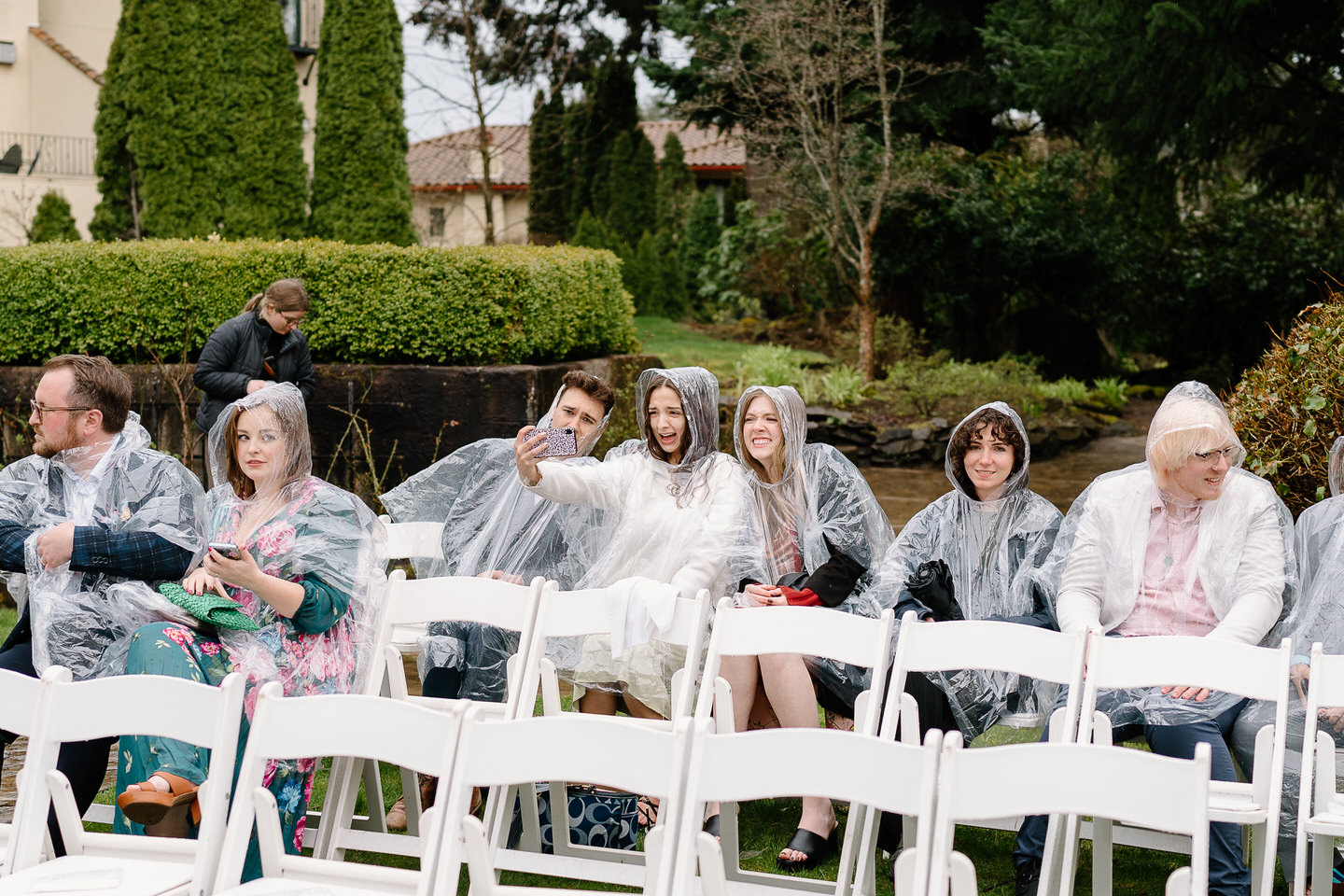 rainy wedding with guests wearing ponchos