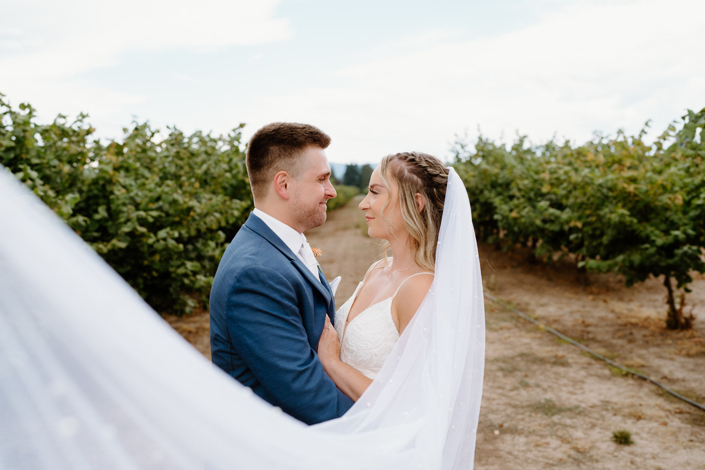 Bride and groom portraits at shadow hills country club with veil flowing
