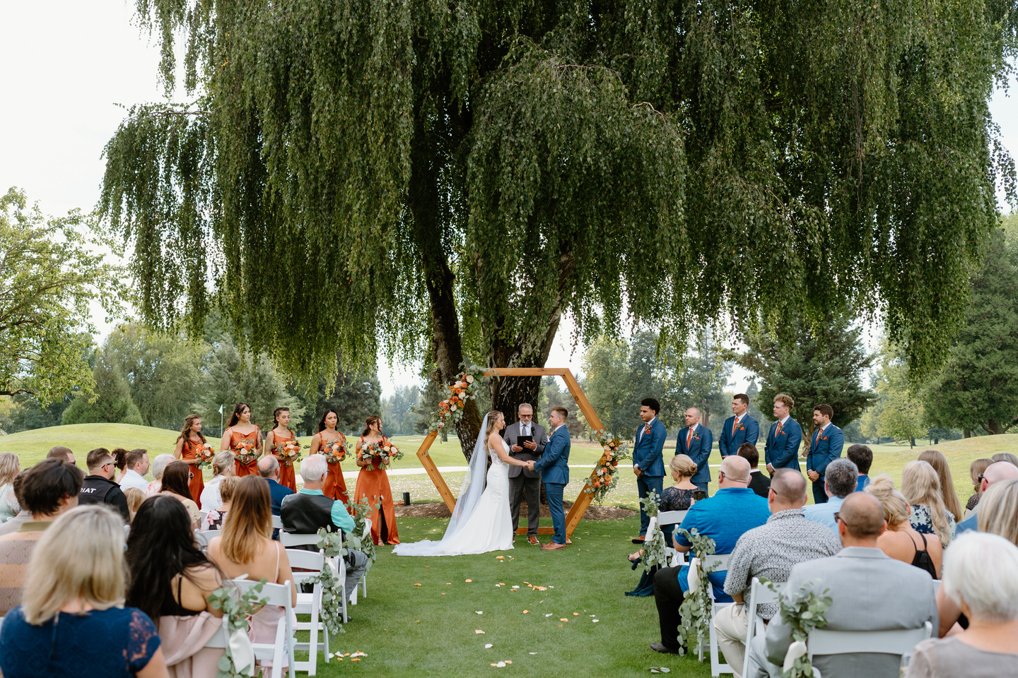 Wedding ceremony under the willow tree at Shadow Hills Country Club