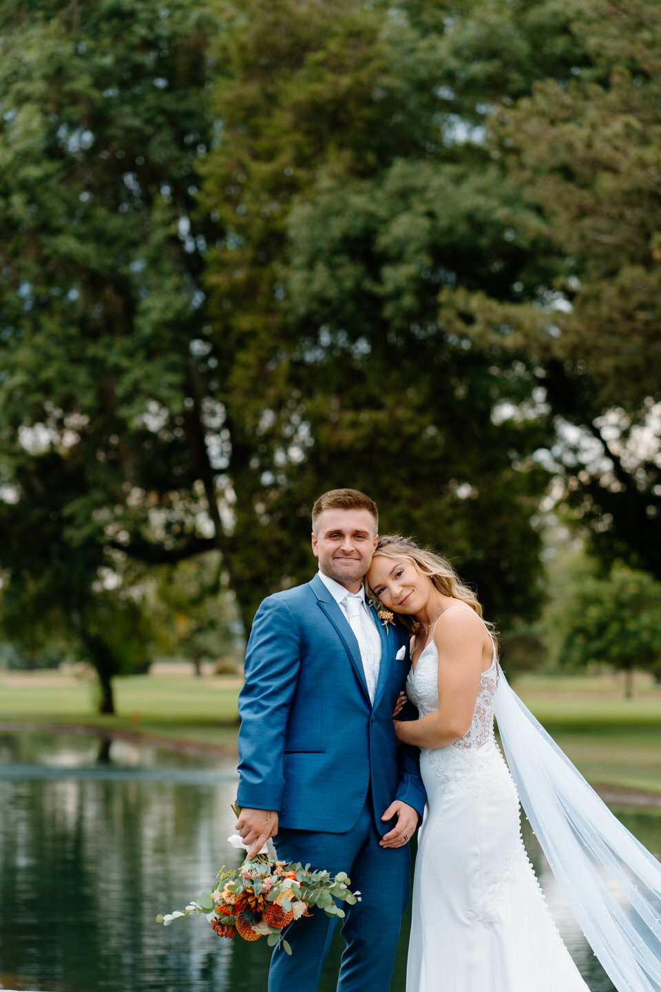 Bride and groom softly smiling together during shadow hills country club wedding