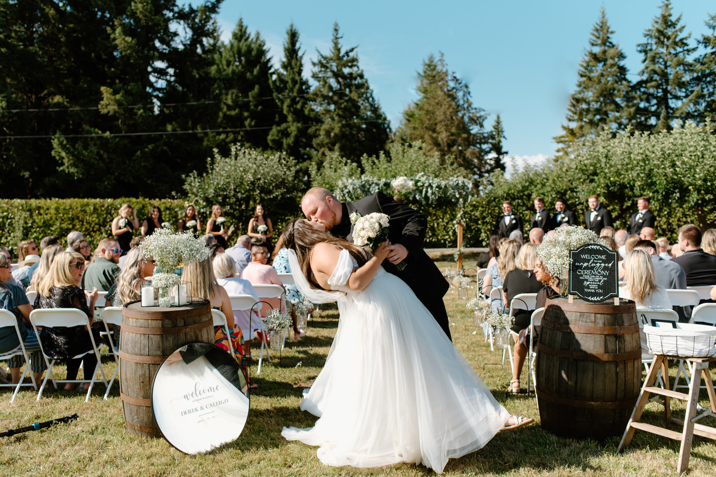 bride and groom kiss after ceremony in backyard in corvallis