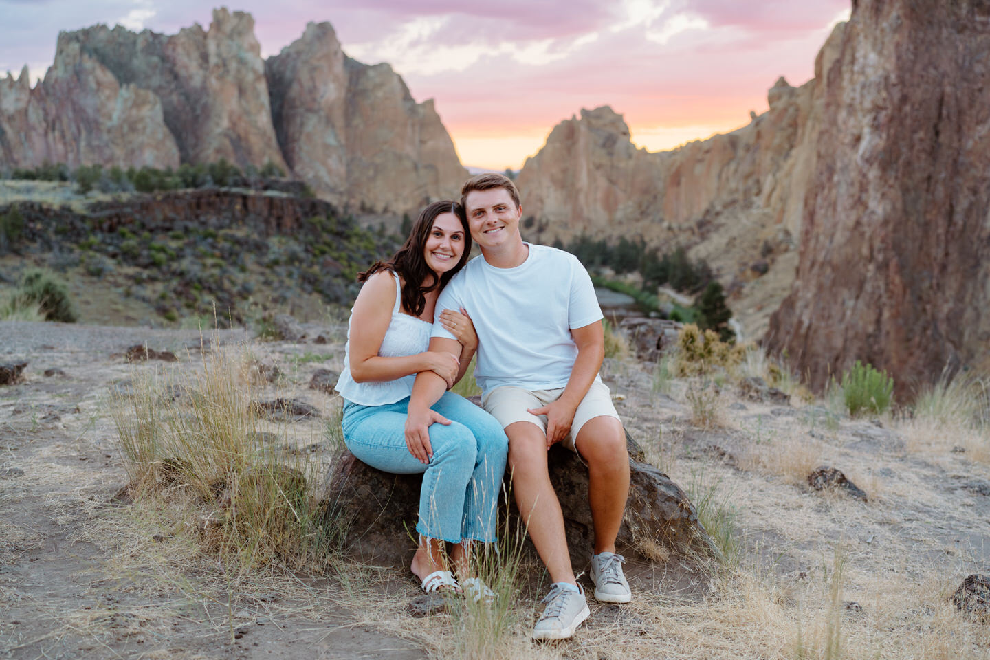 Sitting on rock for engagement photos at Smith Rock