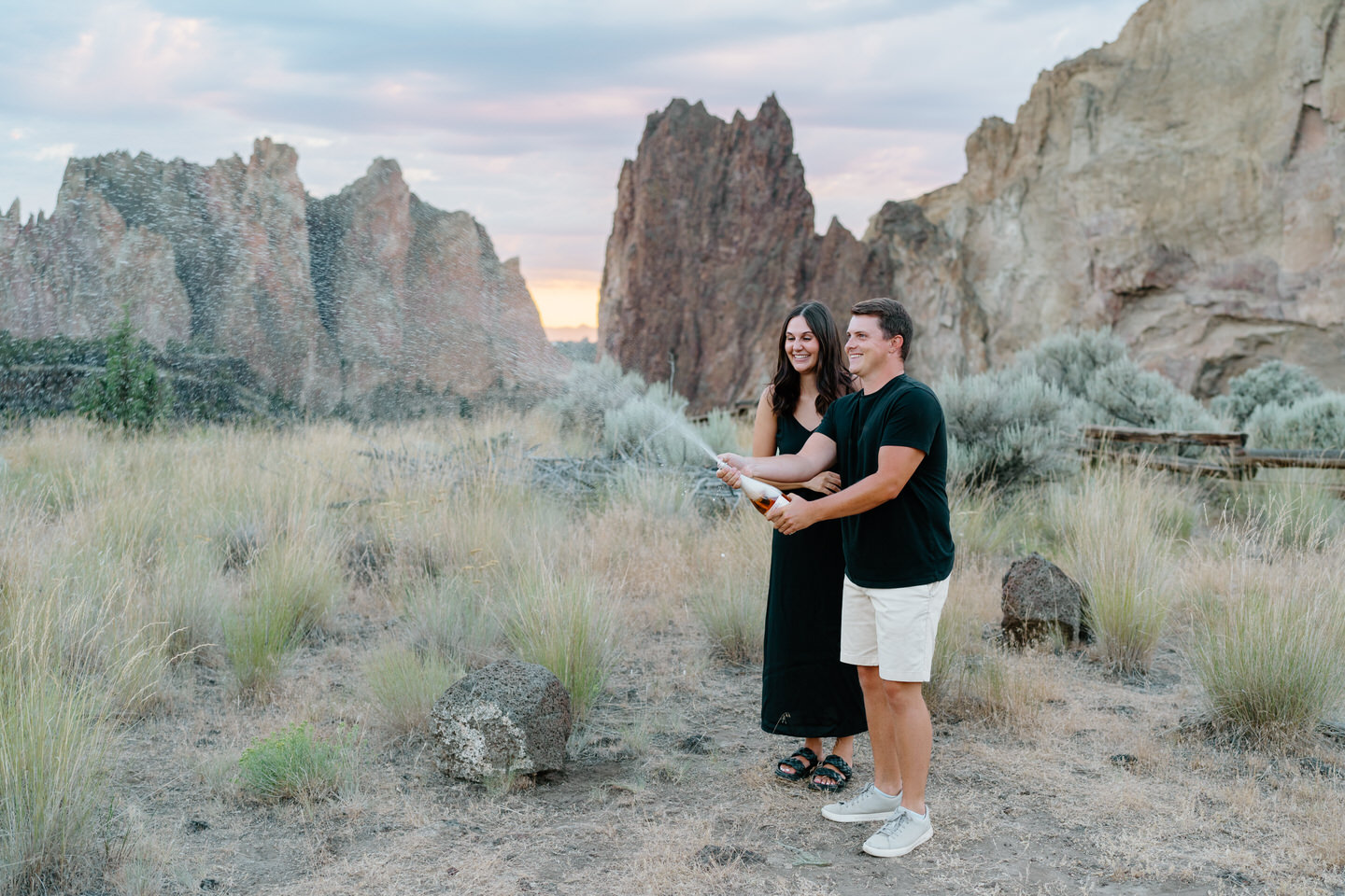 popping champagne during Smith Rock engagement photos