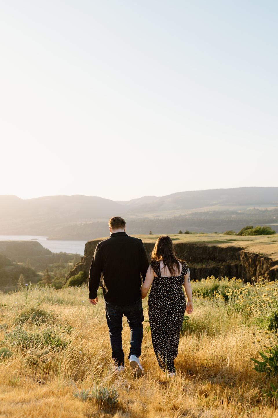 couple walking away in columbia river gorge