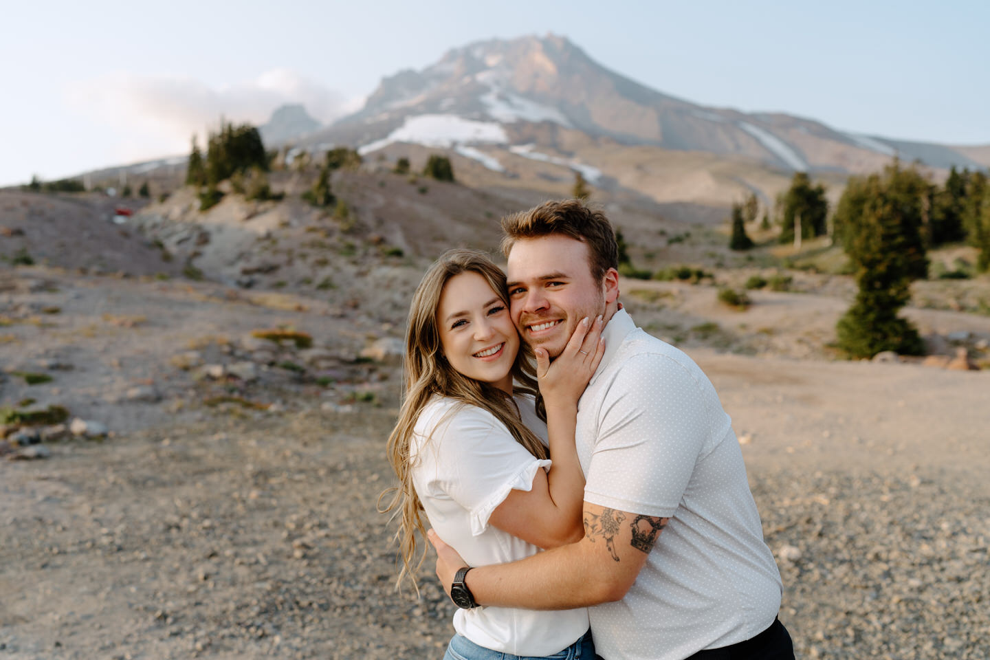 couple touching cheeks for couples photos at mt hood