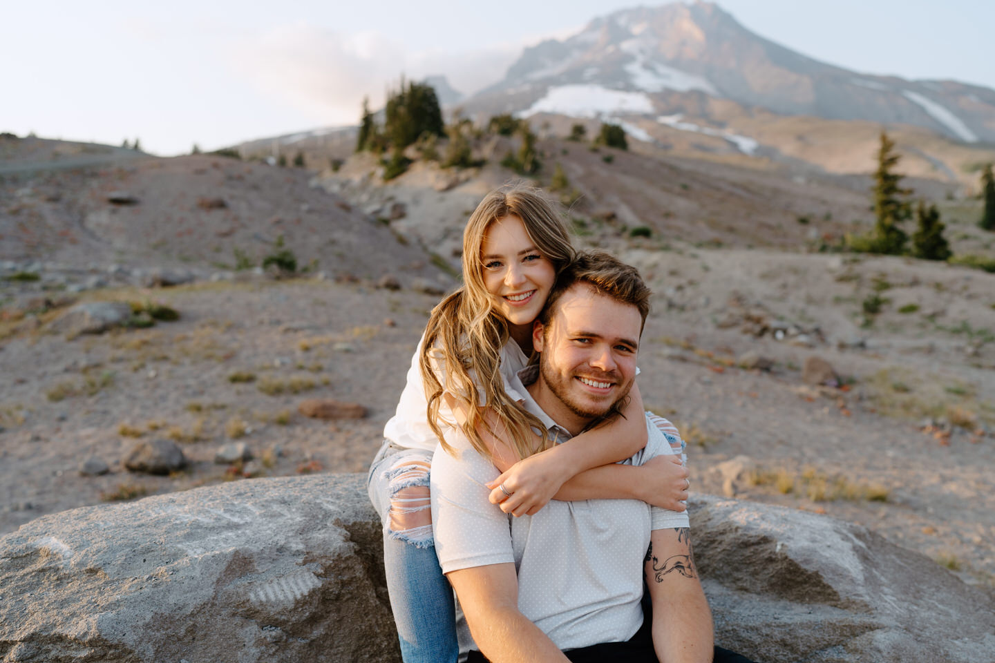 woman wrapping her arms around man during couples session at mt hood