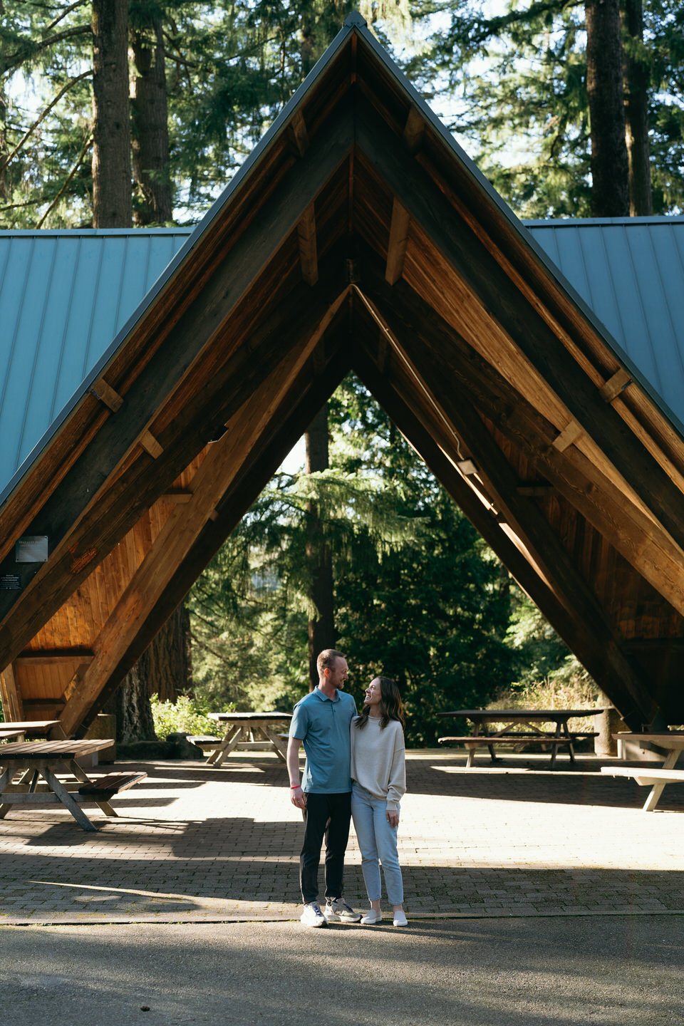 couple standing under Hoyt Arboretum pavilion