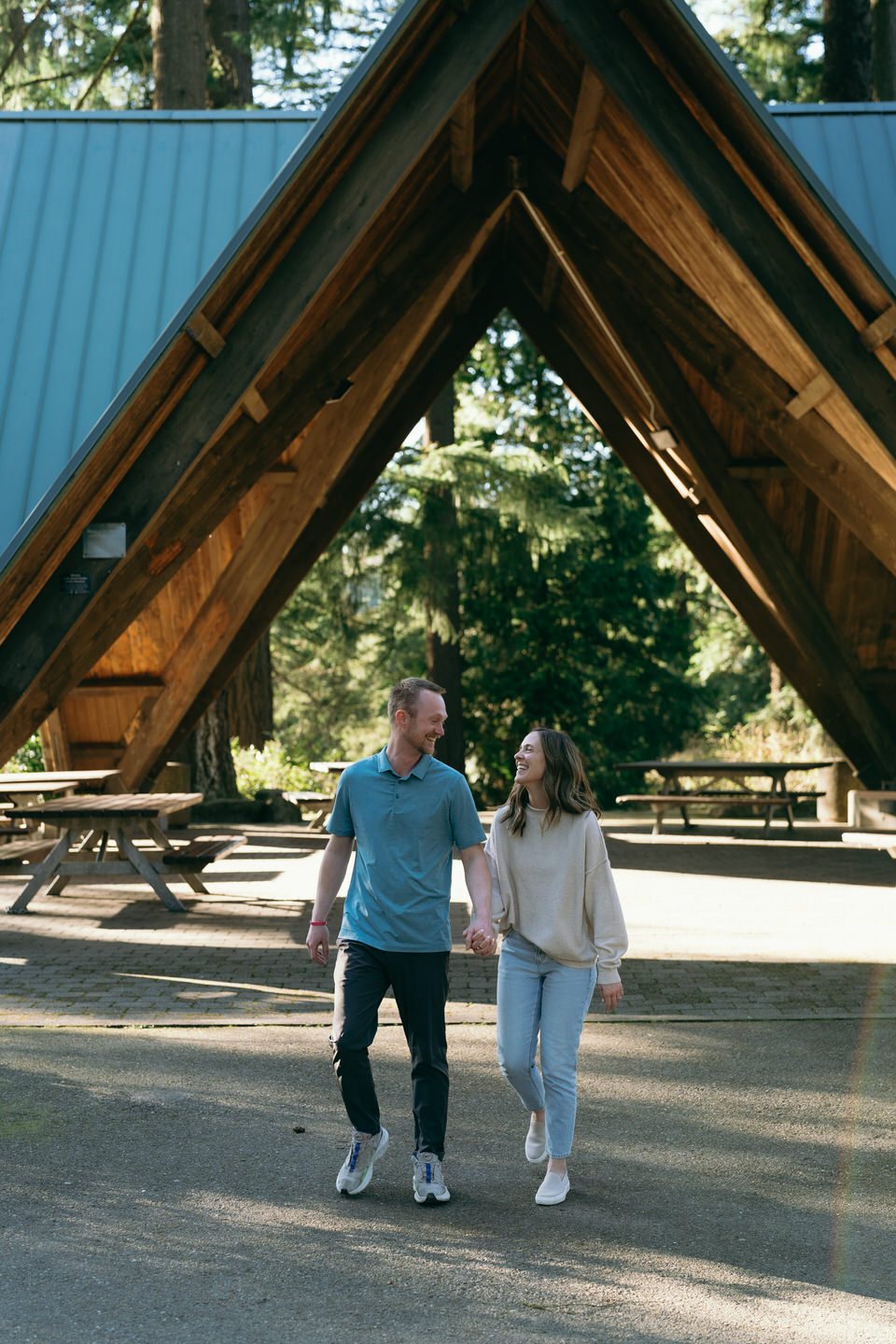 couple walking in front of Hoyt Arboretum pavilion
