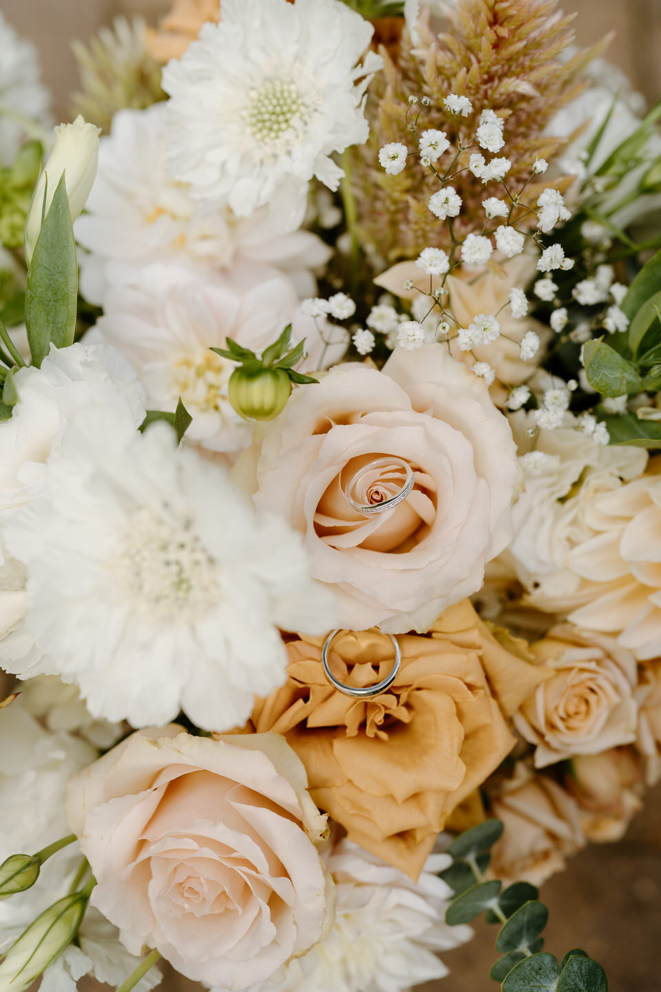 wedding bands in bridal bouquet