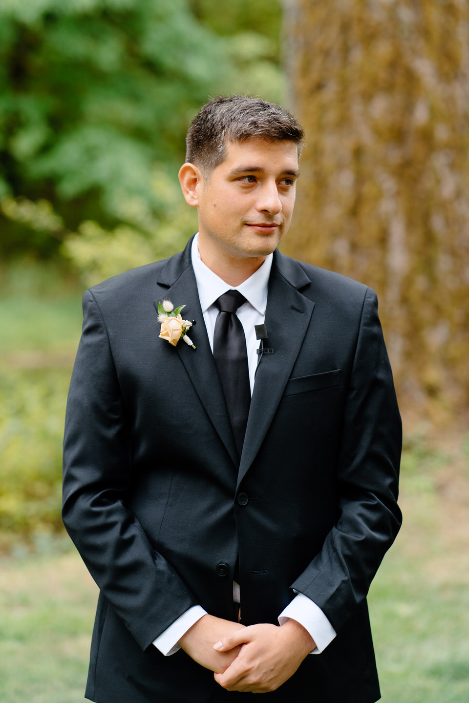 Groom sees his bride for the first time during their wedding ceremony at Navarra Gardens.